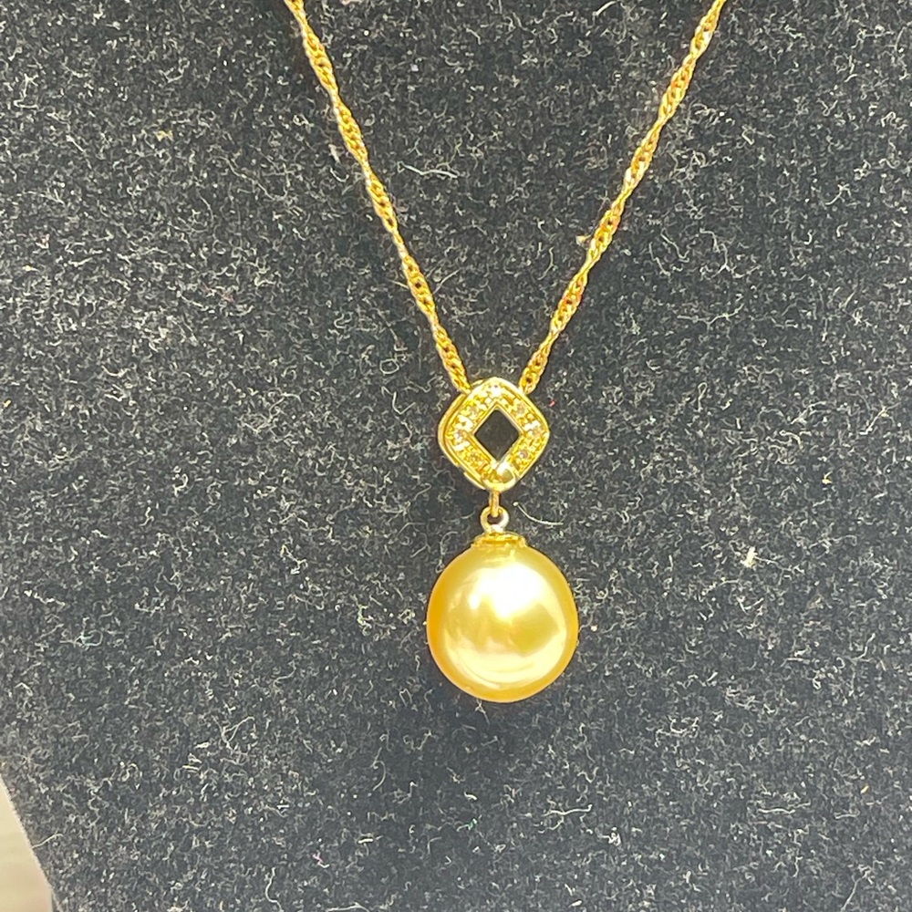 SouthSea Gold Color Pearl 12.9 mm in 18 k Necklace size 18 inches with diamond.